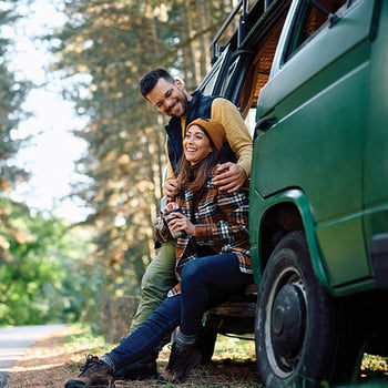 happy couple sitting in car