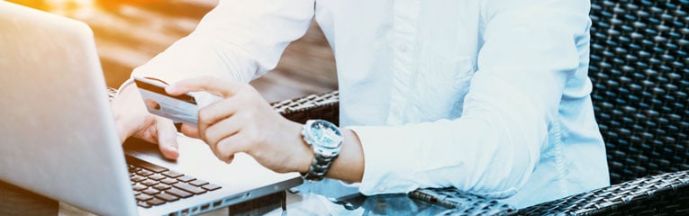 Credit-cards-for-bad-credit-can-improve-your-score-if-you-use-it-responsibly-like-this-man-checking-his-bill-on-his-laptop.