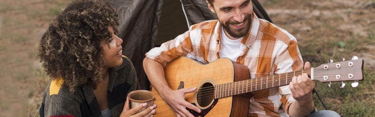 Peach-State-has-the-Valentines-Day-Gift-Ideas-to-Keep-Your-Budget-Man-Playing-Guitar-for-Woman-Outside