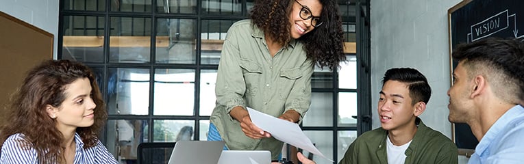 Young diverse coworkers discuss project-1