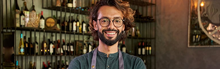 Young man takes photo at work