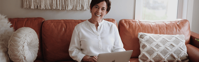 woman on her laptop researching afforadable loans