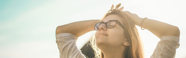 woman-feeling-relaxed-with-hands-on-her-head-after-receiving-a-debt-consolidation-loan-peach-state-can-help