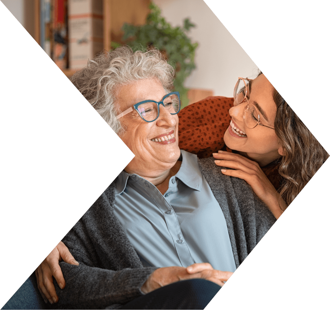 Young woman helping an older woman save money with a Peach State Savings Account